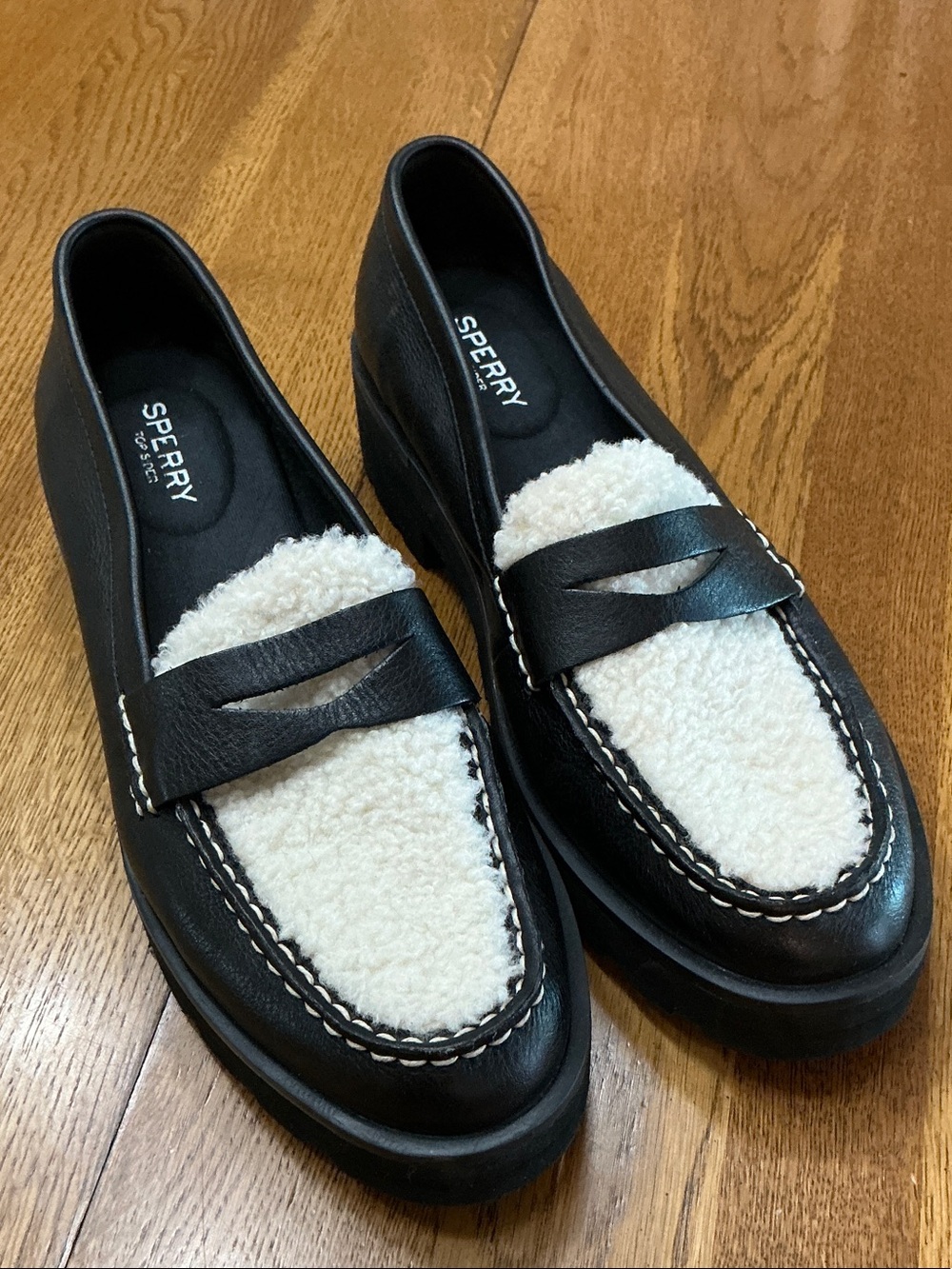 Woman’s Sperry black leather loafers with fleece top. Size 9. Black sole. New!